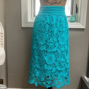 Crocheted teal colored skirt. Size is M/L